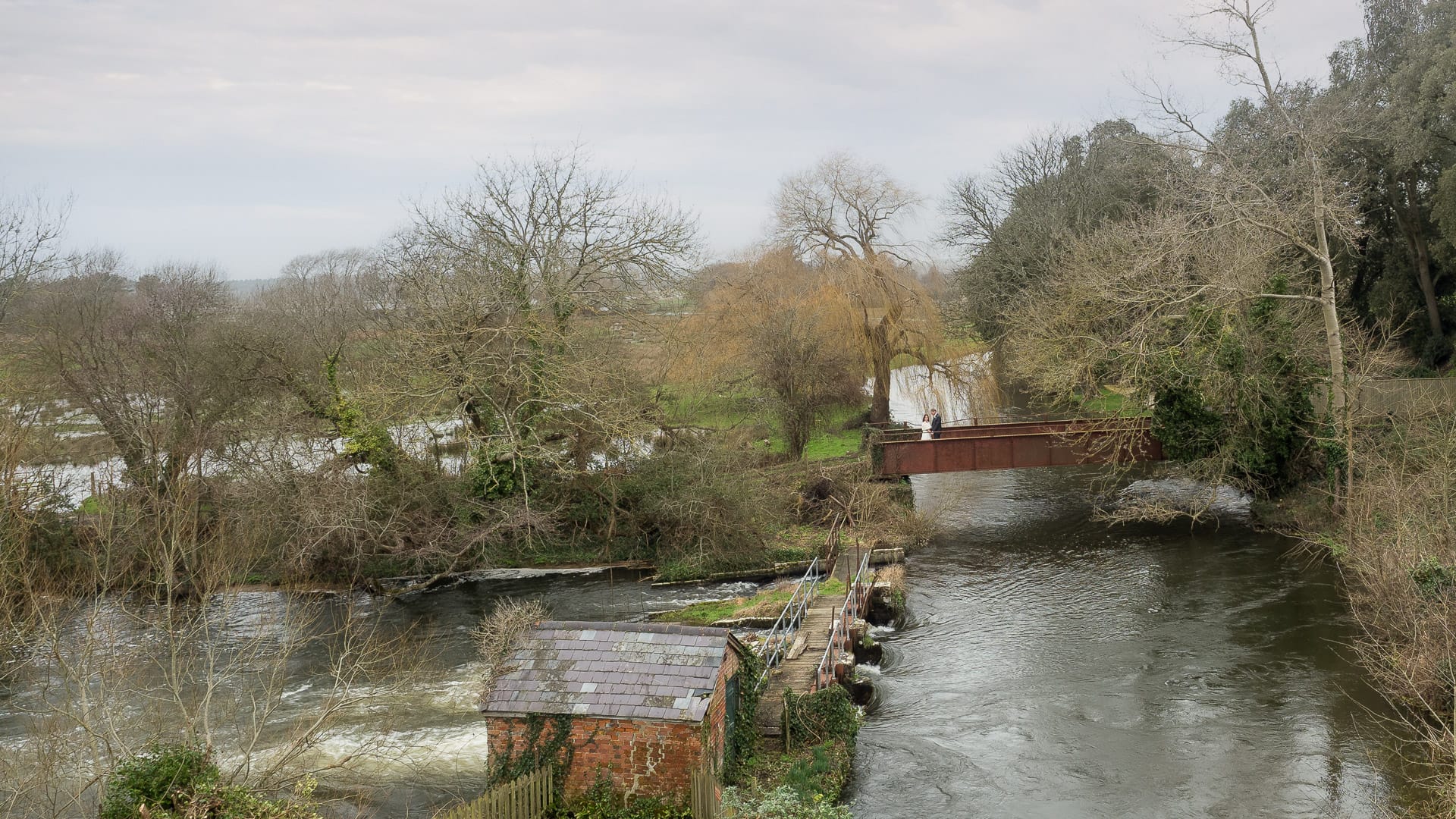 Bride and groom on the old railway bridge near Sopley Mill