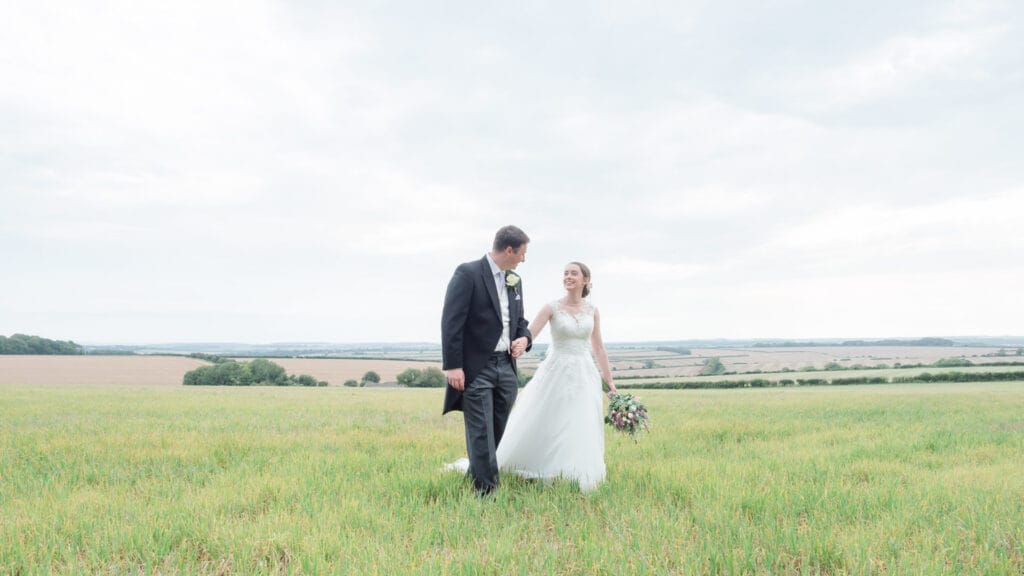 Michaela and Rupert walking across a field