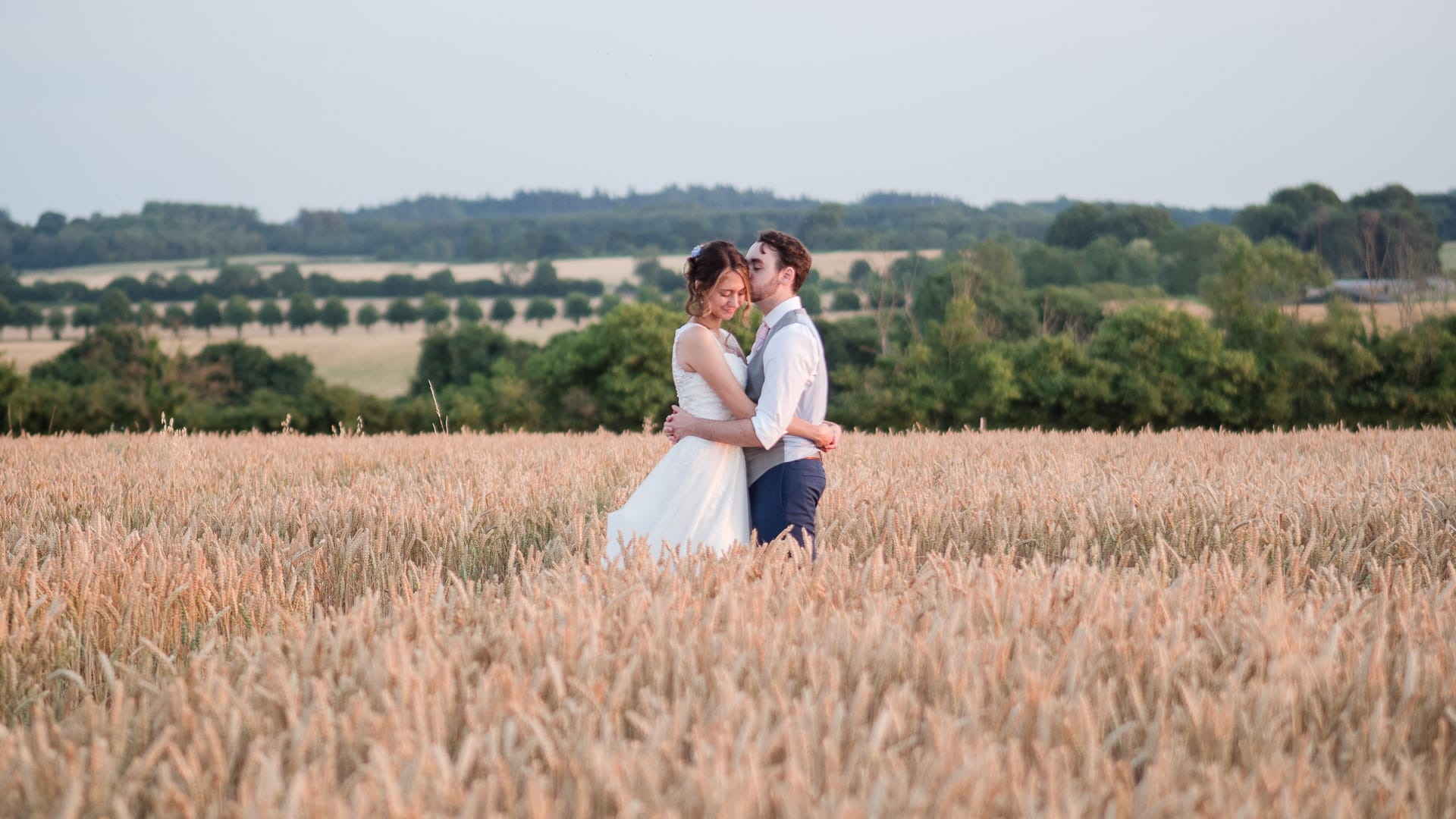 Couple embrace in cornfield