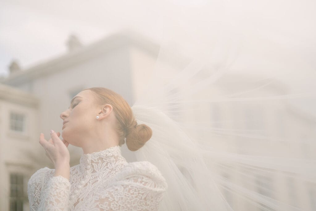 Bride with billowing veil outside Rookesbury Park.