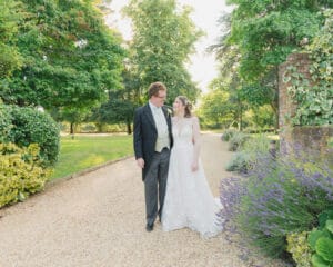 Bride and groom on the drive at Carey's Manor